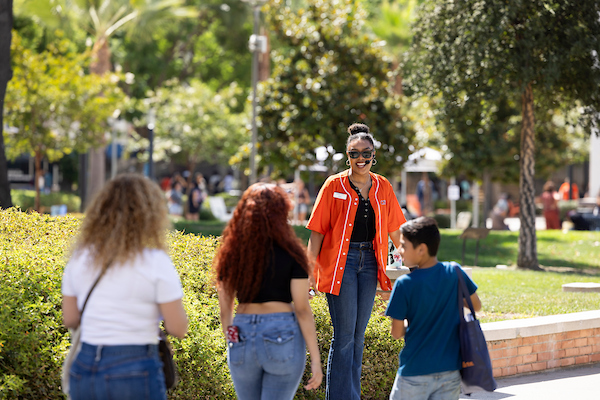 csuf employee giving a campus tour