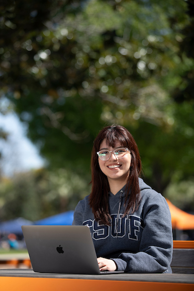 girl on computer outside